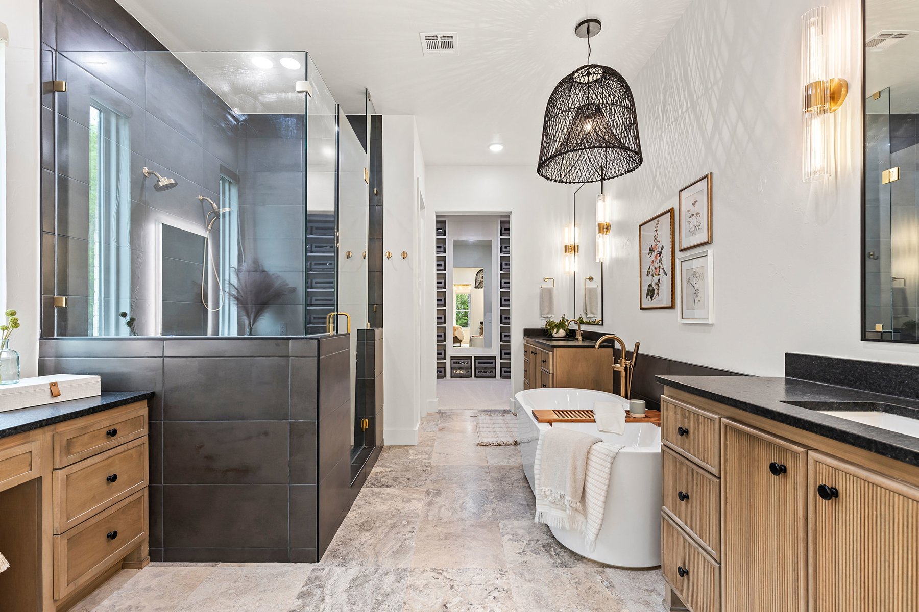 Primary bathroom suite with glass walk-in shower and freestanding tub