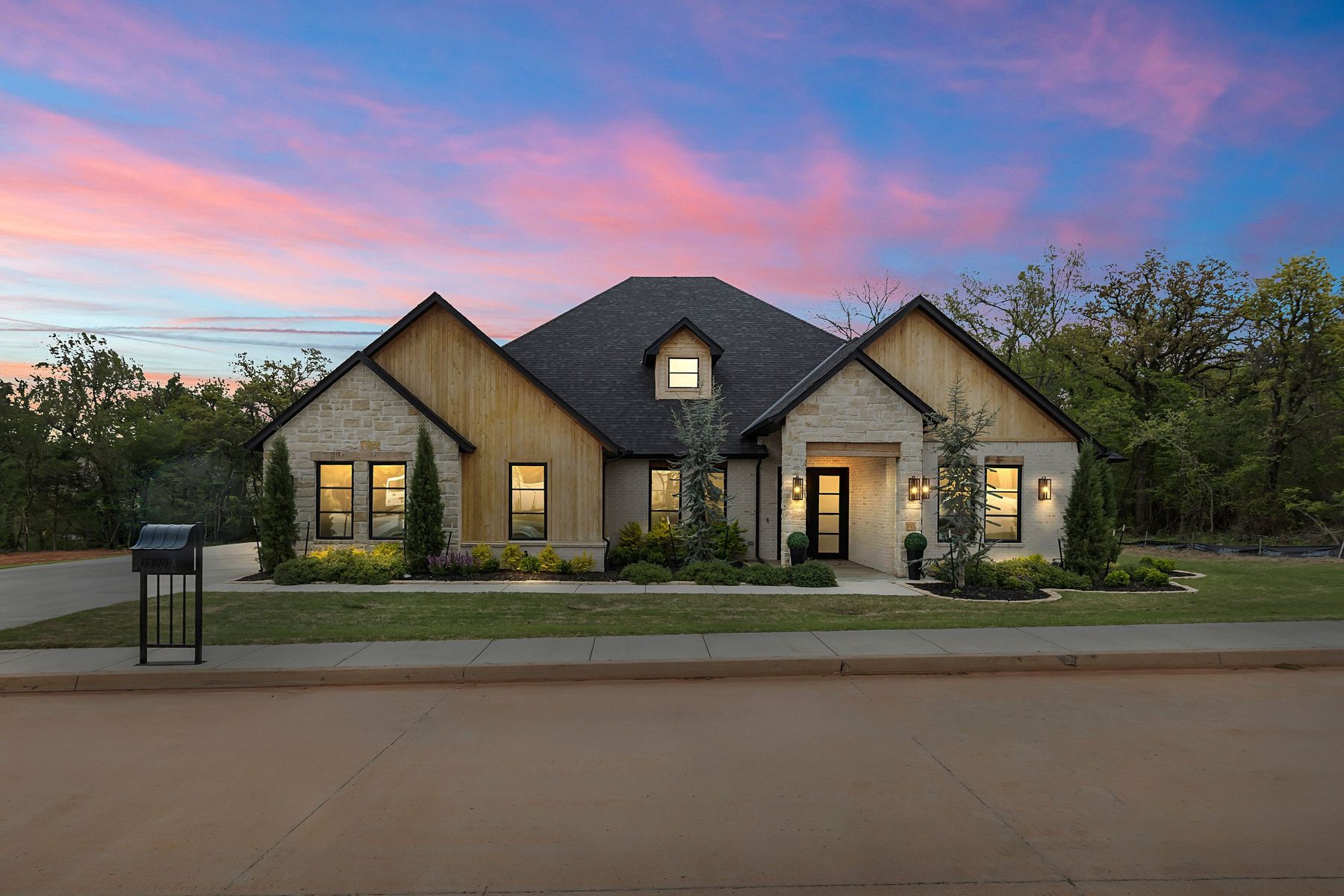 Daytime exterior digitally transformed into a twilight scene